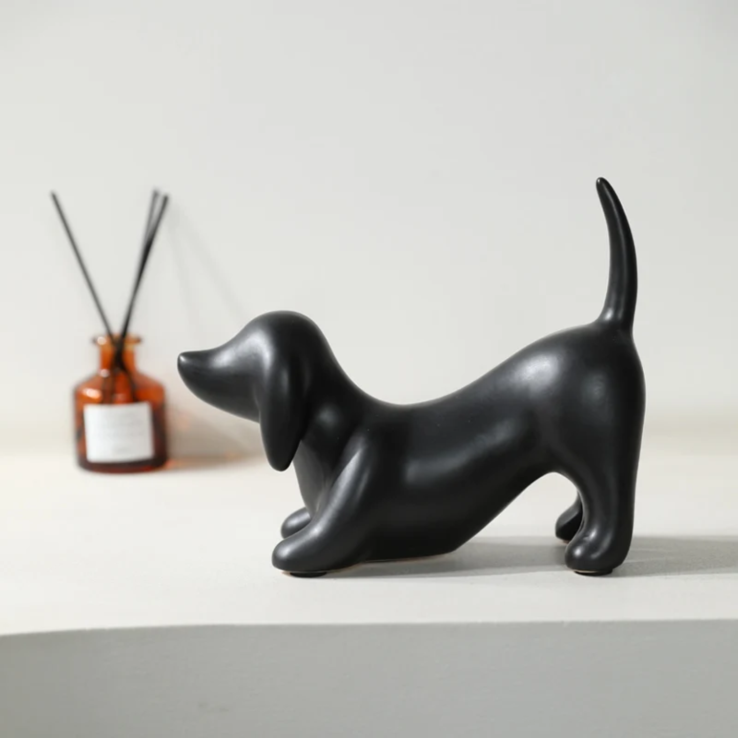 CERAMIC BENT DOG FIGURE 19.7*16 cm